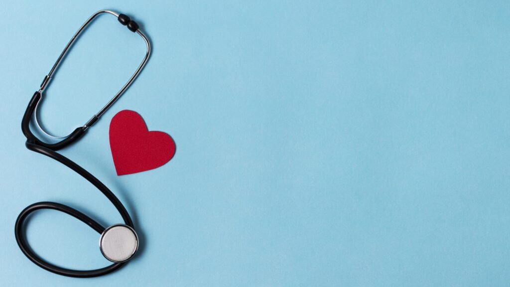 Stethoscope and red heart on a blue background