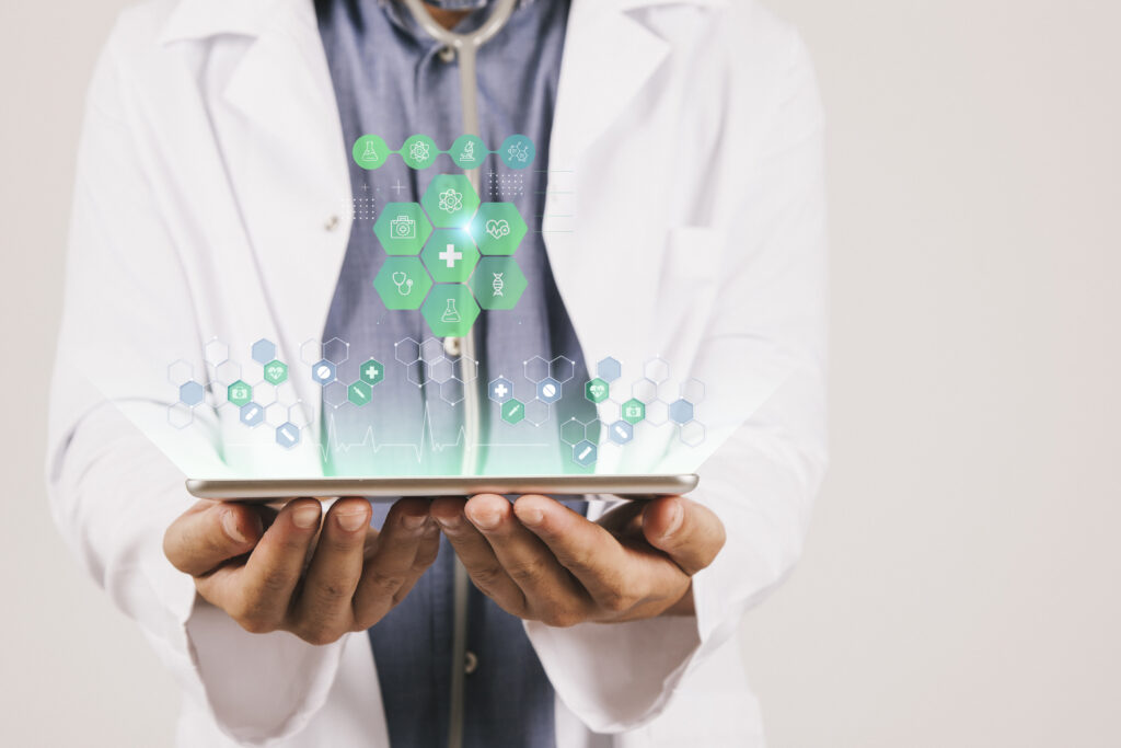 Doctor holding a tablet with digital health icons